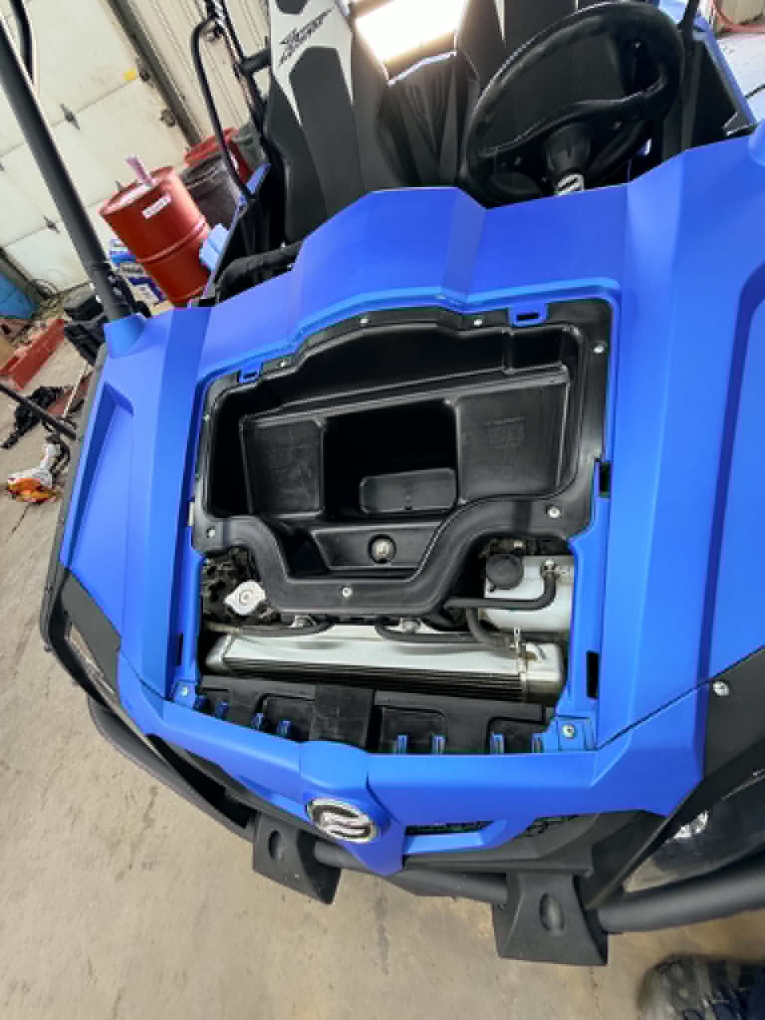 Clean UTV front storage compartment after detail