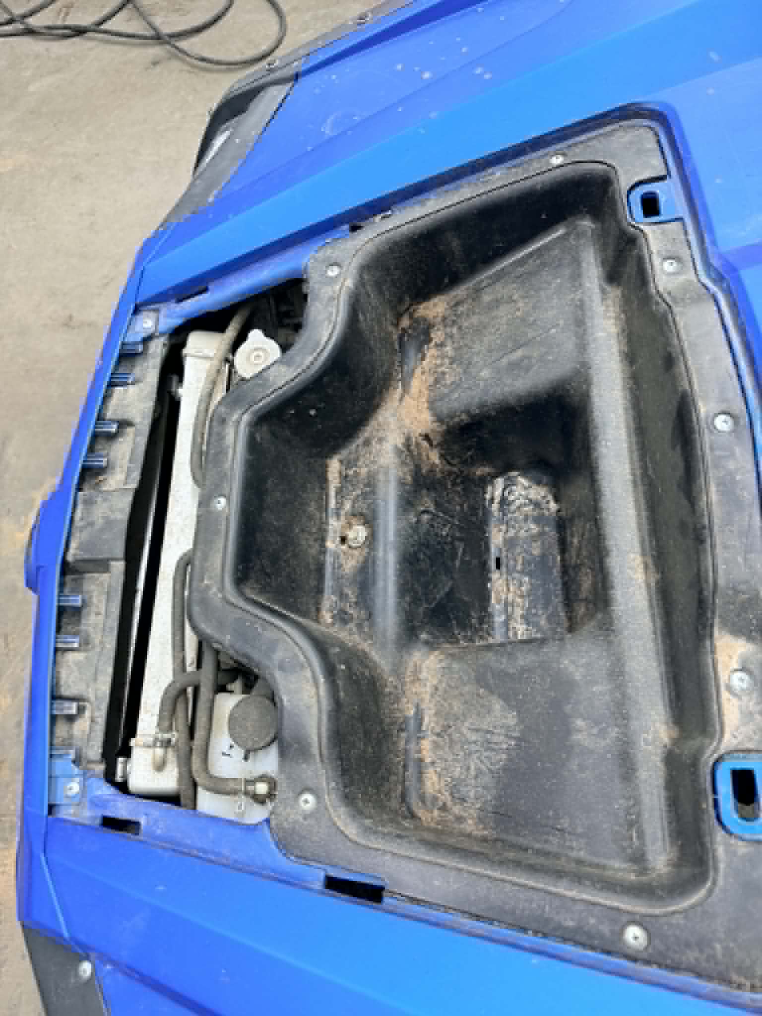 Dirty UTV front storage compartment before detail