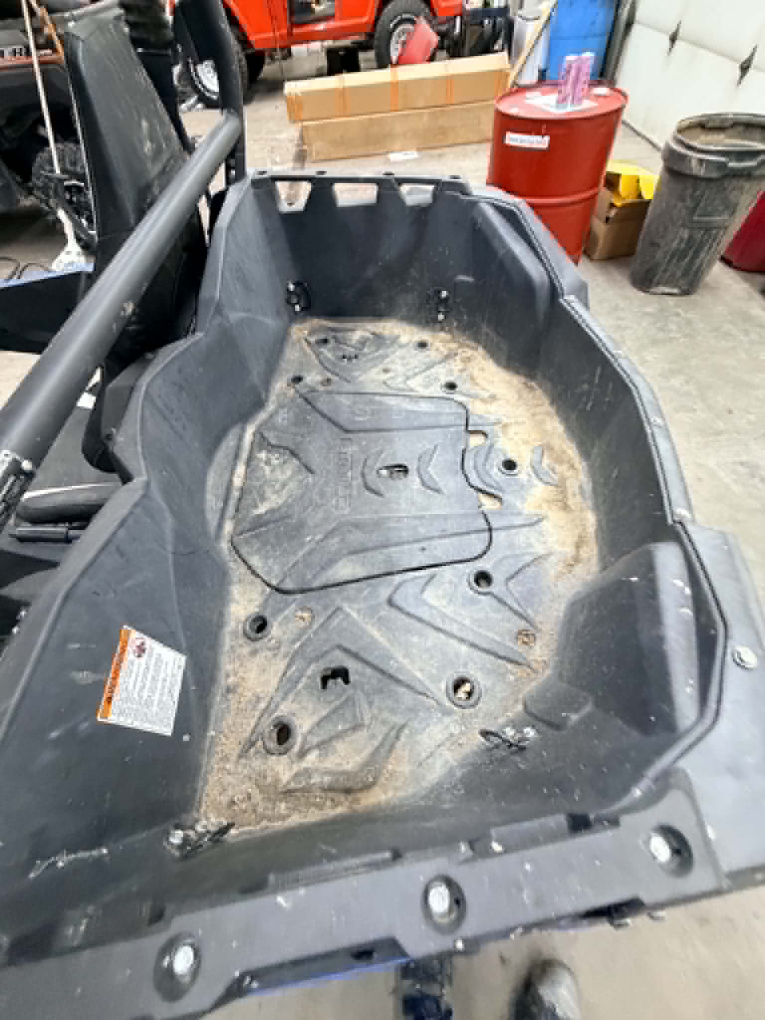 Dirty UTV rear cargo bed before detail